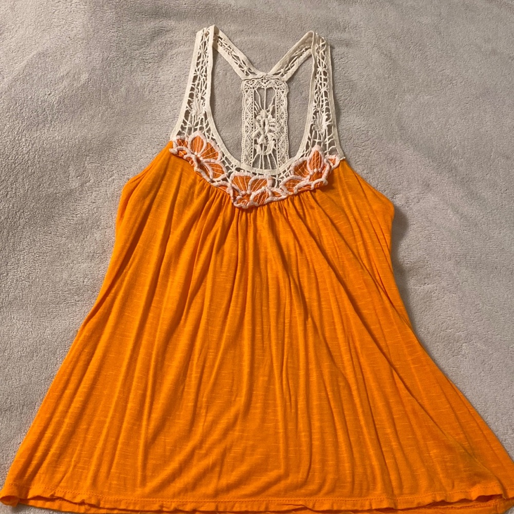 Sleeveless top with decorative straps made of 100% Rayon by Rue 21 in medium.
